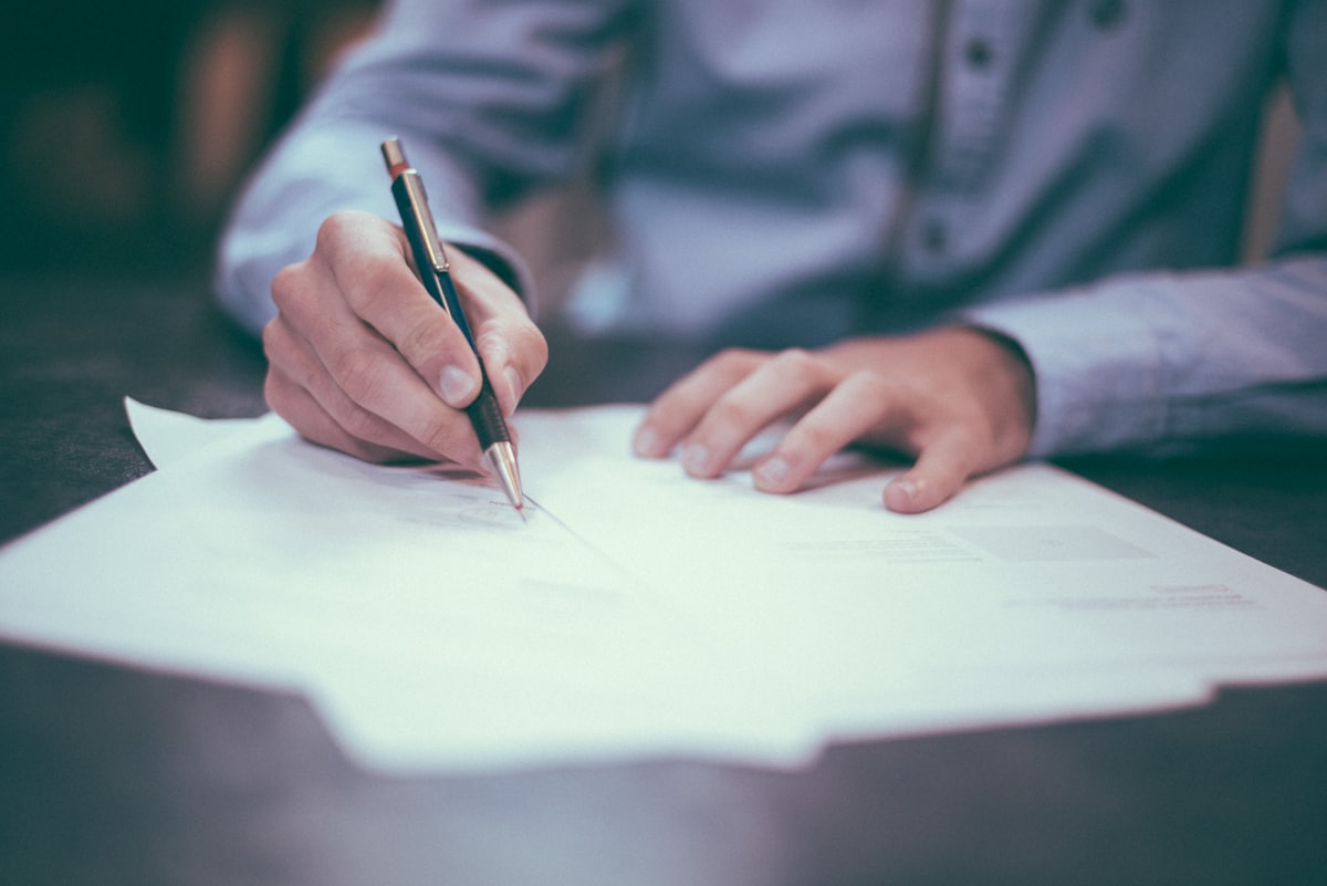 Couple reviewing a financial checklist together at their desk