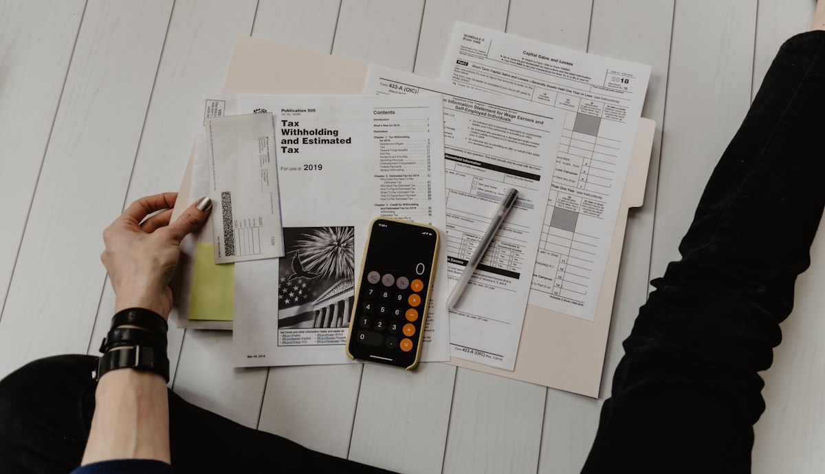 Couple reviewing bills and finances together at their kitchen table